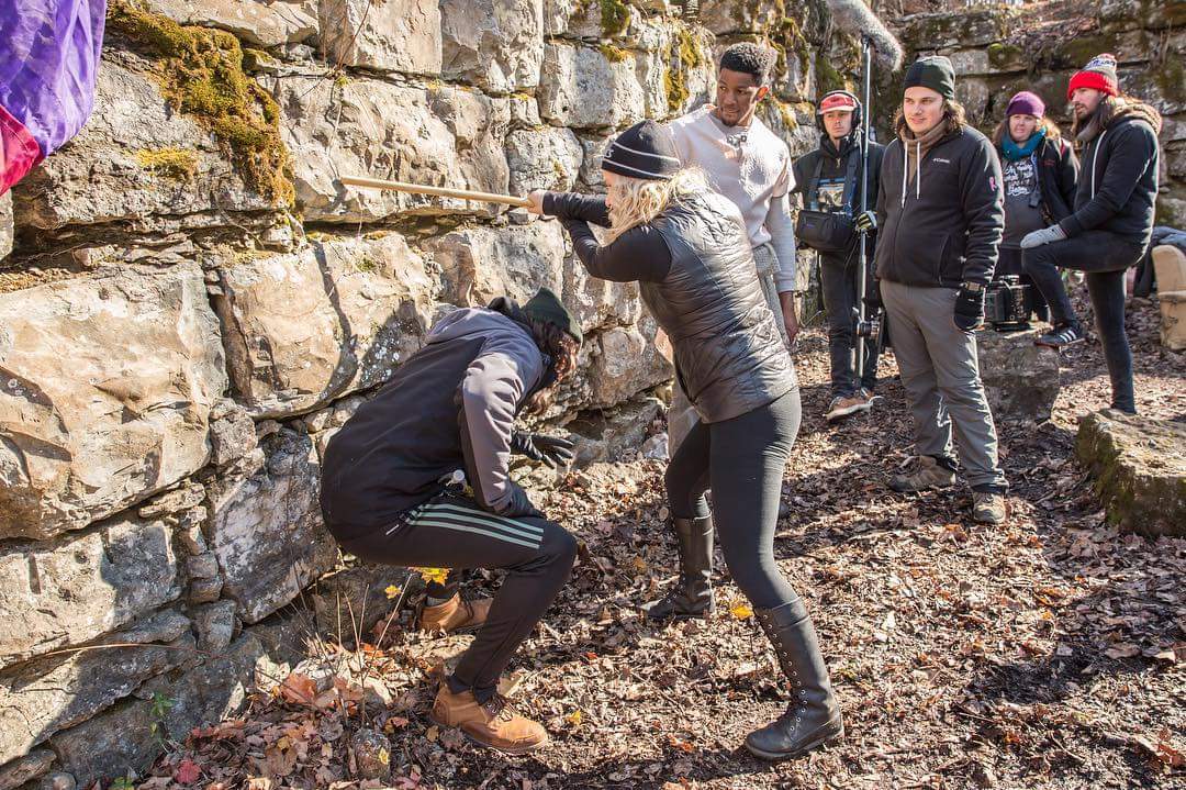 OmegaPictures's tweet photo. Second Unit Director Alicia Rodis runs through a fight scene while the cast and crew watch on location at Old Stone Fort State Archaeological Park. https://t.co/IjcPzaLQL4