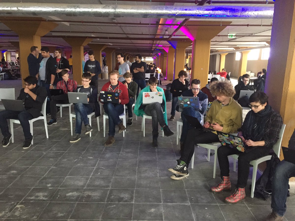 MLHacks's tweet photo. The @blackrock capture the flag challenge at #hex2018 is in full swing as hackers are using ruby to solve bugs 🐜 https://t.co/AG6y2aPolT