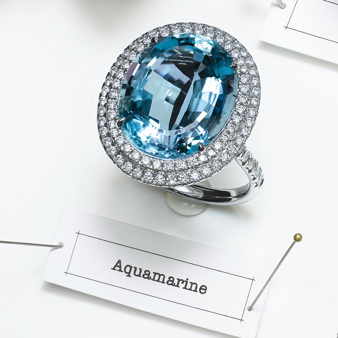 TiffanyAndCo's tweet photo. True beauty can’t be held down. A notable exception, spotted in #ThisIsTiffany, is this electric aquamarine surrounded by rows of diamonds. https://t.co/XoKuAa9joq