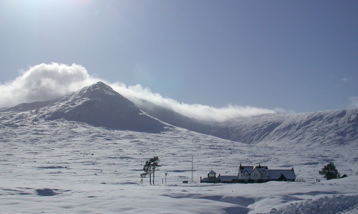Corrour Station on the West Highland line.  The peak of Leum Uilleim in the background.