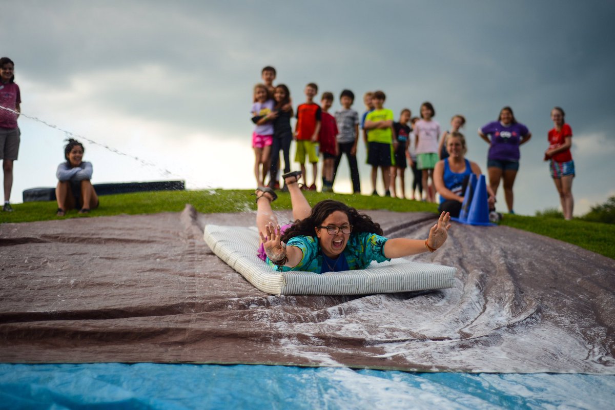 MichiganYcamps's tweet photo. It’s FUN AND CRAZY WEEK on Michigan Y Camping Social Media! Let’s kick it off with this crazy fun slip and slide photo. Can you get more fun and crazy? Stay tuned #miycamps https://t.co/XXtGcUwNer