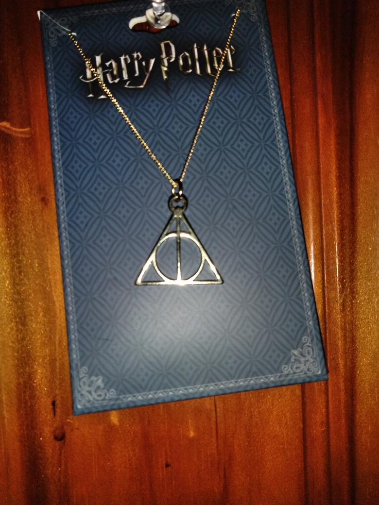 deon_gillam's tweet image. Got me my #HarryPotter necklace 
#TheThreeBrothers