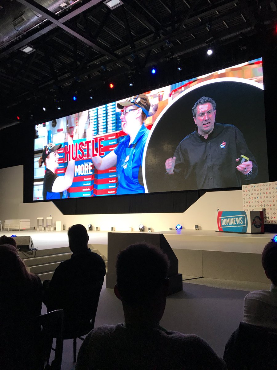 DominosRally's tweet photo. COO Simon Wallis takes to the stage again to encourage our store managers to hustle more! #DominosRally2018 https://t.co/tZVKsSzKvL