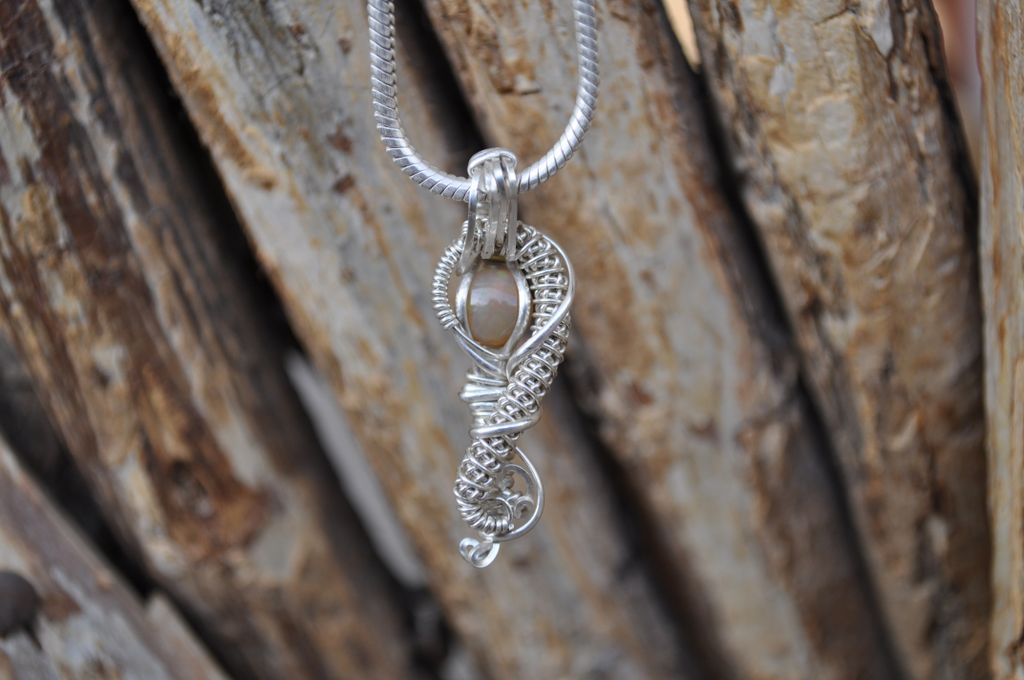 Rawvolutionjwls's tweet image. This Stunning Ethiopian Opal Cabochon is hand wrapped in .925 sterling silver wire. I snagged this beauty at the #tuscongemshow in February from the Ethiopian men that mined and worked the gems. I assure you the picture does no justice! Available on my etsy shop!