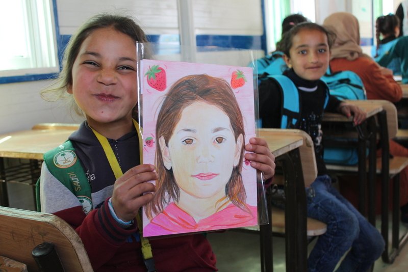UNICEF's tweet image. &quot;Oh, they drew strawberries on my portrait... I love strawberries!&quot; 🍓

Children at Za’atari refugee camp in Jordan were delighted to receive their personal portraits from student artists as part of the amazing #MemoryProject with @UNICEFJordan → memoryproject.org