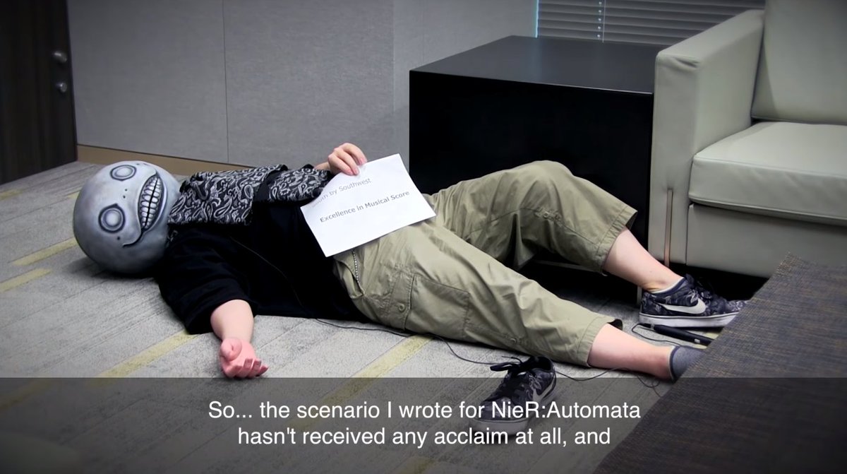 eggloaf's tweet photo. If you haven't already, please enjoy Yoko Taro sprawled on the floor with one shoe off like a big baby, salting about how Okabe is winning all the NieR:Automata awards. https://t.co/szZTeROyk9