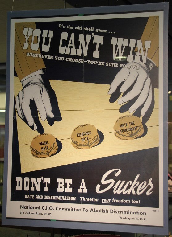 HornbakeLibrary's tweet photo. "Don't Be a Sucker, Hate and Discrimination Threaten Your Freedom Too" poster is the #exhibitspotlight! Though this poster was made in the 1950s this sentiment is still being discussed today. Come check out all our other #UMDLabor posters in the exhibit gallery today! @AFLCIO https://t.co/PE02JtYkiT