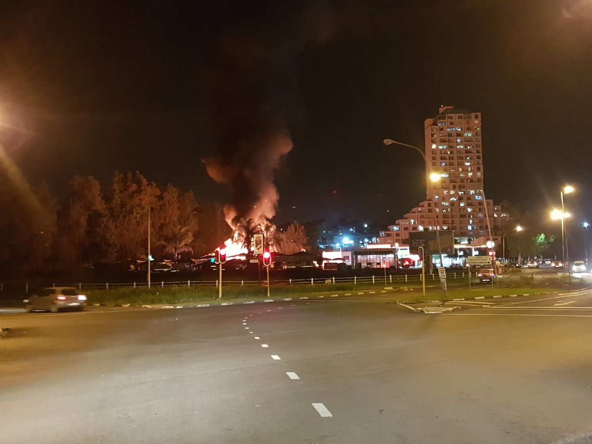 DheranGhela's tweet photo. Woodburn Garage, Midlands Caravan in Pietermaritzburg on fire. Avoid Durban Road. @TrafficSA https://t.co/uRfeRcG7Ps