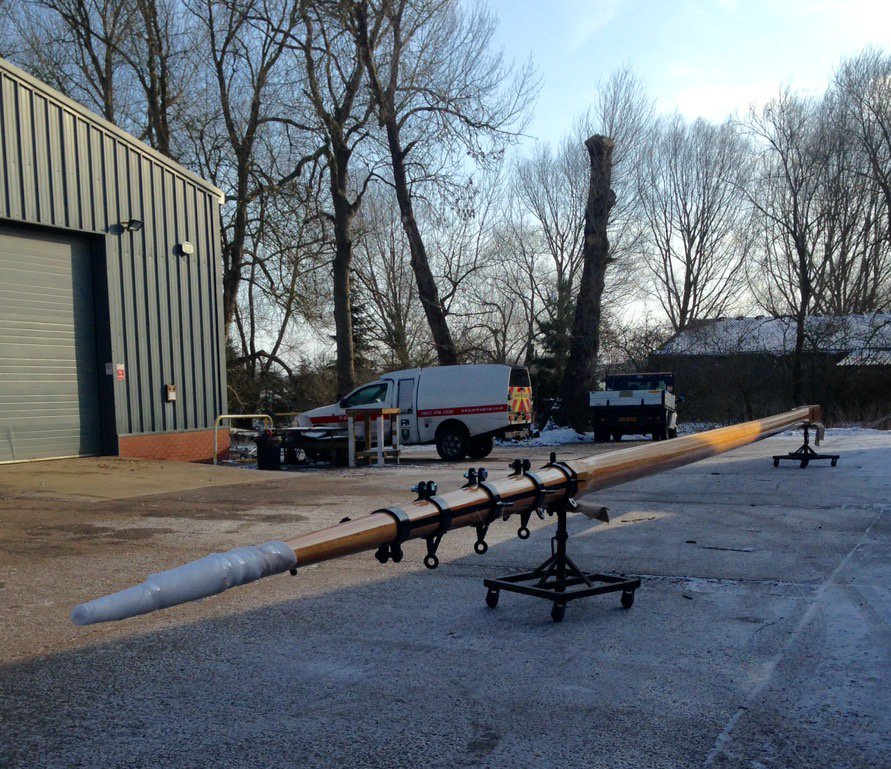 A cold and frosty morning and the first of two large masts leaving the work. Waiting for the trailer to arrive.
