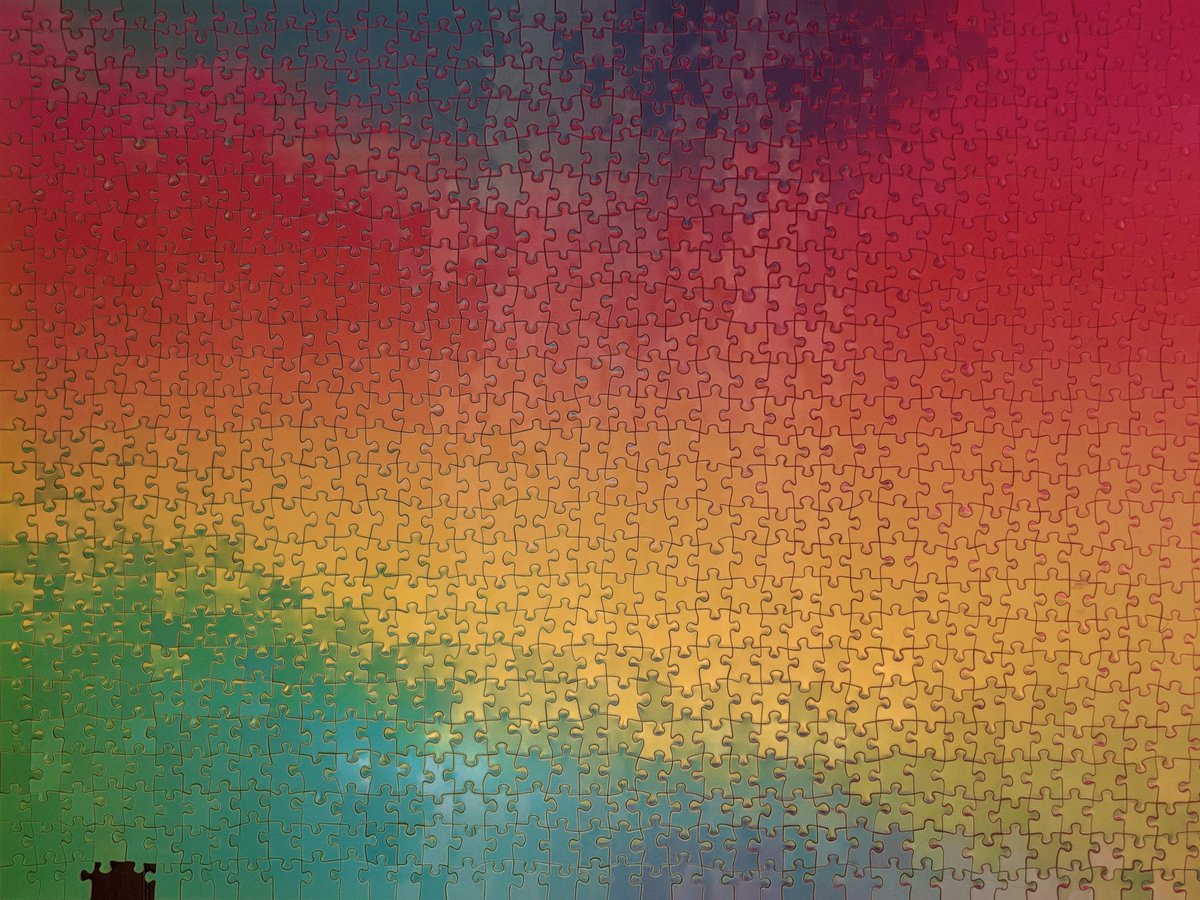 color changing puzzle completed, except for two missing edge pieces