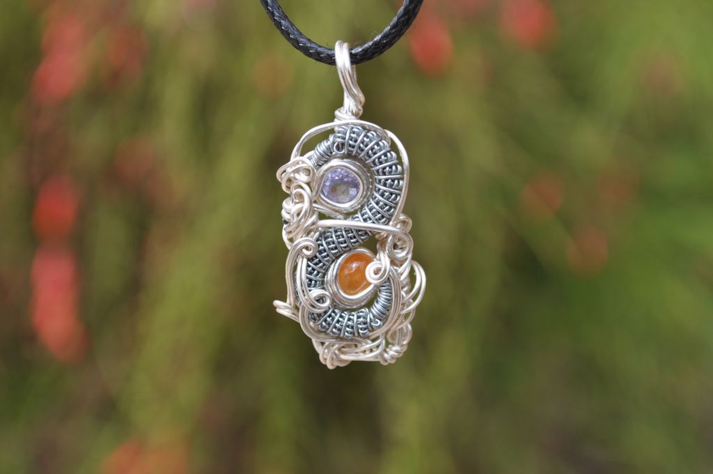 Rawvolutionjwls's tweet image. Tanzanite and Orange Opal wrapped in stainless steal and silver plated copper wire.

Pendant dimensions : 1.5 inches x .6 inches
