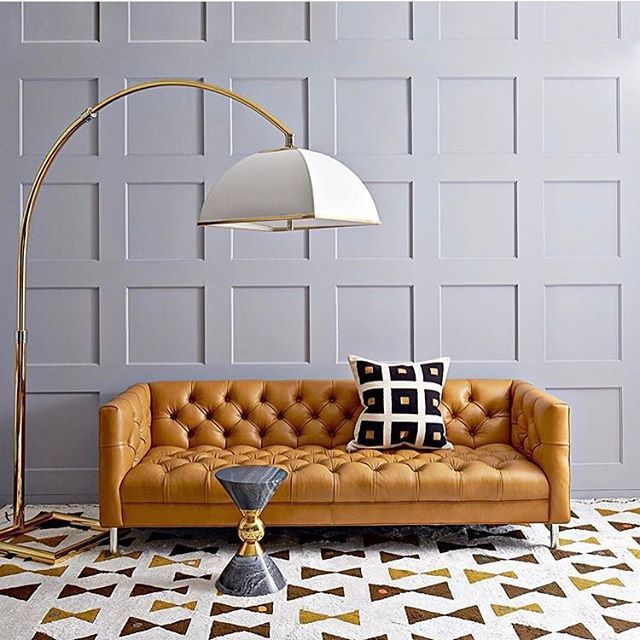 The beautiful Baxter couch by @jonathanadler 😍 Superb colour palate and a feast for the eyes with the use of texture and play on geometric shapes 😍 Divine!  #thedesignbug .
.
.
.
.
#grey #panelling #sofa #leathersofa #lighting #lamp #geometric #jonat… bit.ly/2puaI4D
