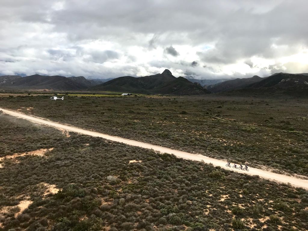 The two leading men's teams - Investec Songo Specialized and Canyon Topeak - disappear into the distance #Untamed #CapeEpic #absacapeepic2018