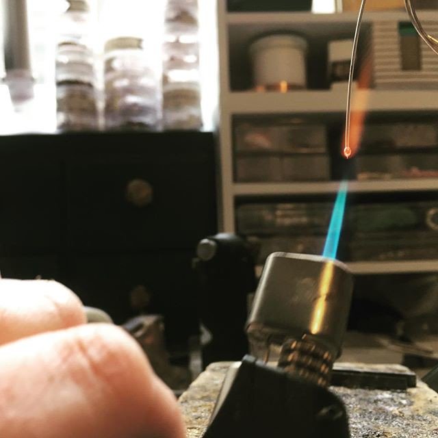 Working on some tiny silver ball studs. It is so fun to watch the end of the wire melt and chase itself up into a ball! 
#onmybenchtoday #ballstuds #tinyearrings #howitsmade #anvilagate #blowtorchesarefun #tinystudearrings