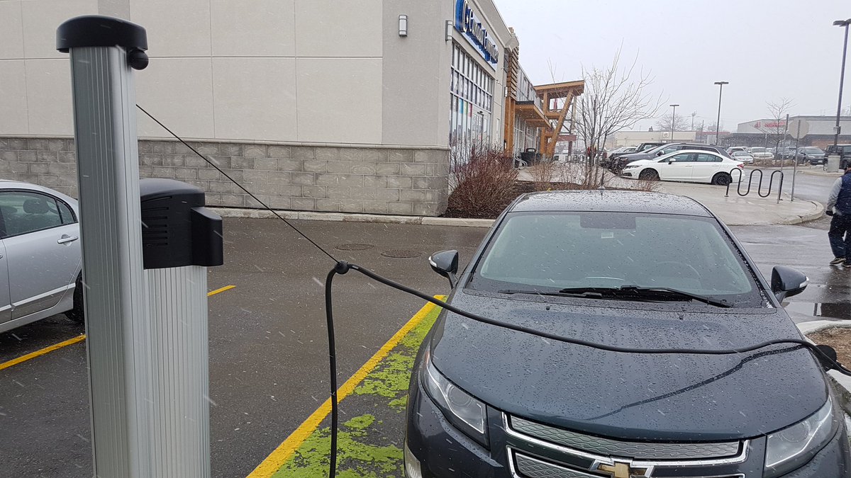 Kwwards's tweet photo. Stopped at my local @MEC on the way home and parked next to an EV station charging a #Volt. More stations around then I realized #CarbonCleanseWR #CommutingWeek @WRSusti @AETGroup https://t.co/BD6RVeVvMR