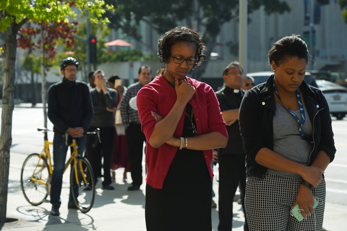 A small crowd gathers to remember Martin Luther King Jr.