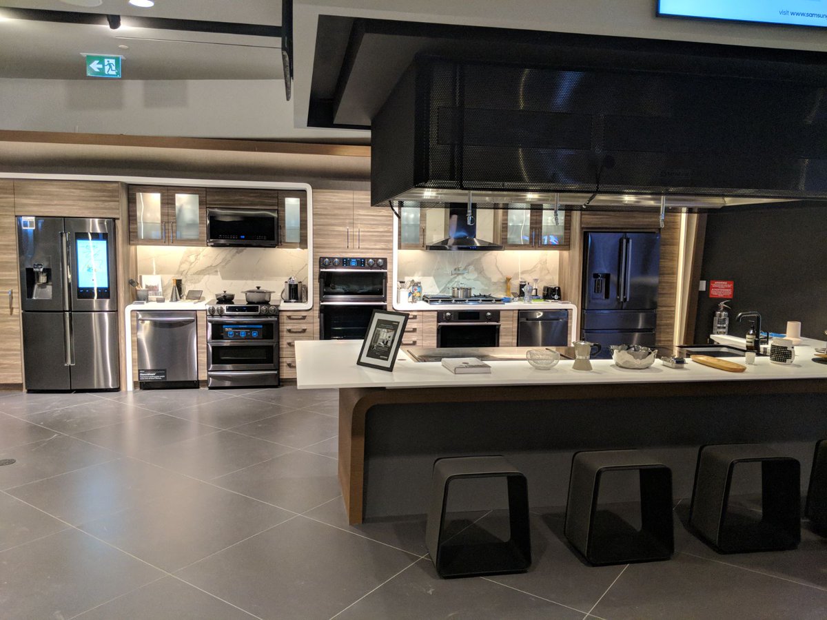 Samsung_Toronto - The recently opened Samsung store in Toronto’s Eaton Centre is not as eye-popping as the Meatpacking location in New York City - it does however adhere to the new line of brick and mortar stores that helps to sell Samsung's brand with it’s style and layout.