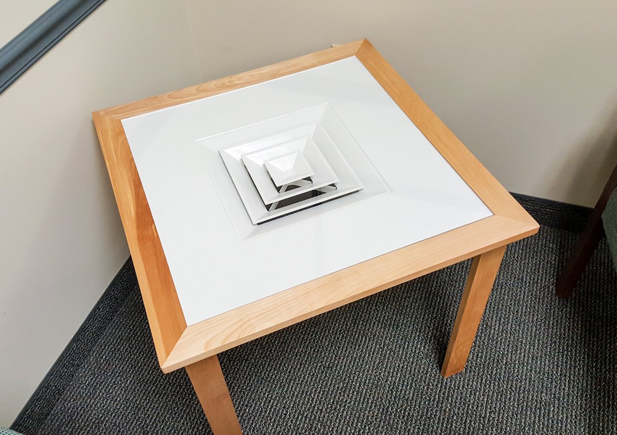 RFPeckCompany's tweet photo. .@NailorHVAC diffusers are not just for overhead air distribution! Mimi McCauley and Bob Muro of our #Albany office came together to create this coffee table masterpiece! #RFPeck https://t.co/YPJ4DeDogF