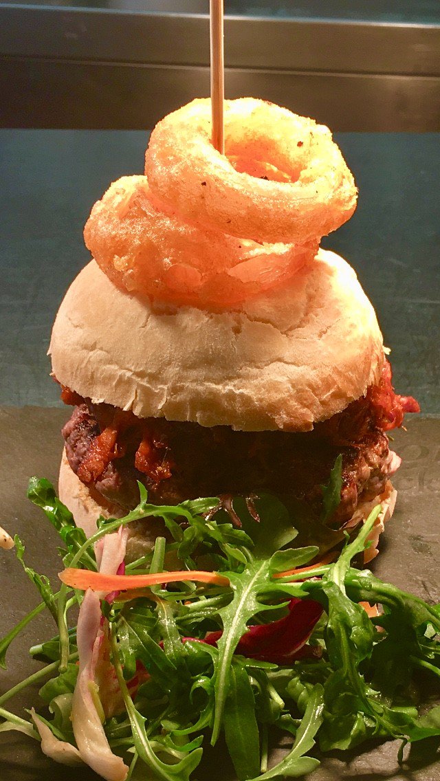 The_Talbot's tweet photo. Tuesday is burger day here at the #talbot today we have a pork and pigeon burger topped with BBQ pulled pork, served in a #talbotbakery bun accompanied with slaw, salad and chips. come along and see what you think! Don't forget tomorrow is pizza day! https://t.co/pnOXn05BTT