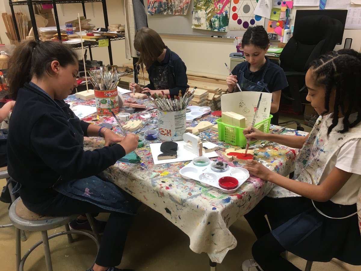 LMPSwoodworking's tweet photo. Ms Gabriele’s 4th grade painting  &amp; cutting out their personal totems all the while singing ‘Chante alleluia’ Fun on a Tuesday! #creativeenergy @LMPSwoodworking @LMPSFineArts @LemanManhattan https://t.co/H4AWAOl9nq