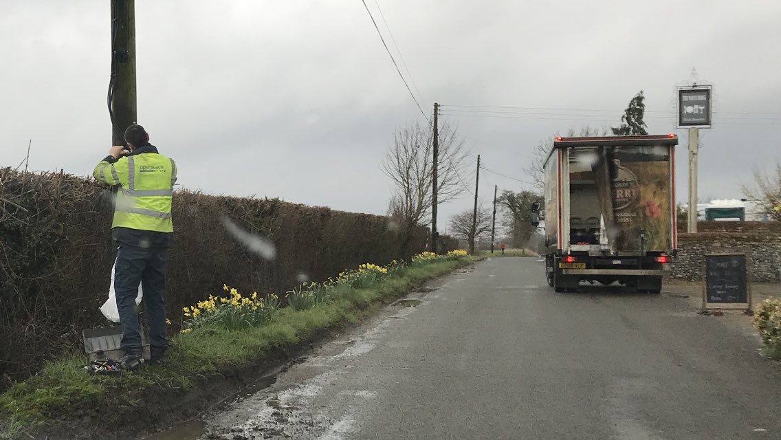 Dazza_Bermuda's tweet photo. It amazes me that @OpenreachHelp doesnโt move its HQ to our village as there is a van here every day! Maybe this guy is the #Solvite man & theyโre feeding him whilst trying to unglue him from this post! Had they installed a green box as promised 2 years ago he wouldnโt be needed https://t.co/9XPAX6Xiam