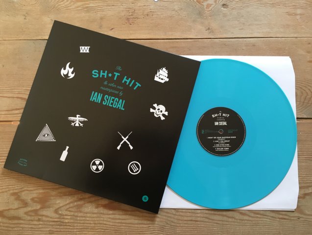 The Sh*t Hit by <a href="/IanSiegal/">Ian Siegal</a> is a collection of 7 new songs available on vinyl exclusively for #RSD18 This limited edition turquoise vinyl comes with a rub-on tattoo of the Sh*t Hit symbol (much like a radioactive warning sign ☢). Check out full info here: bit.ly/2IshYWE