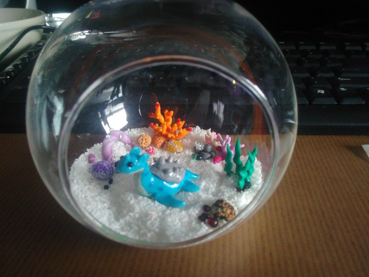SilencedDesires's tweet photo. Got inspired by youtube channel @NerdECrafter 
Don't have any resin, too expensive.., so made it like this. Still works!
#lapras #pokemon #polymerclay #biome https://t.co/Honoibci0j