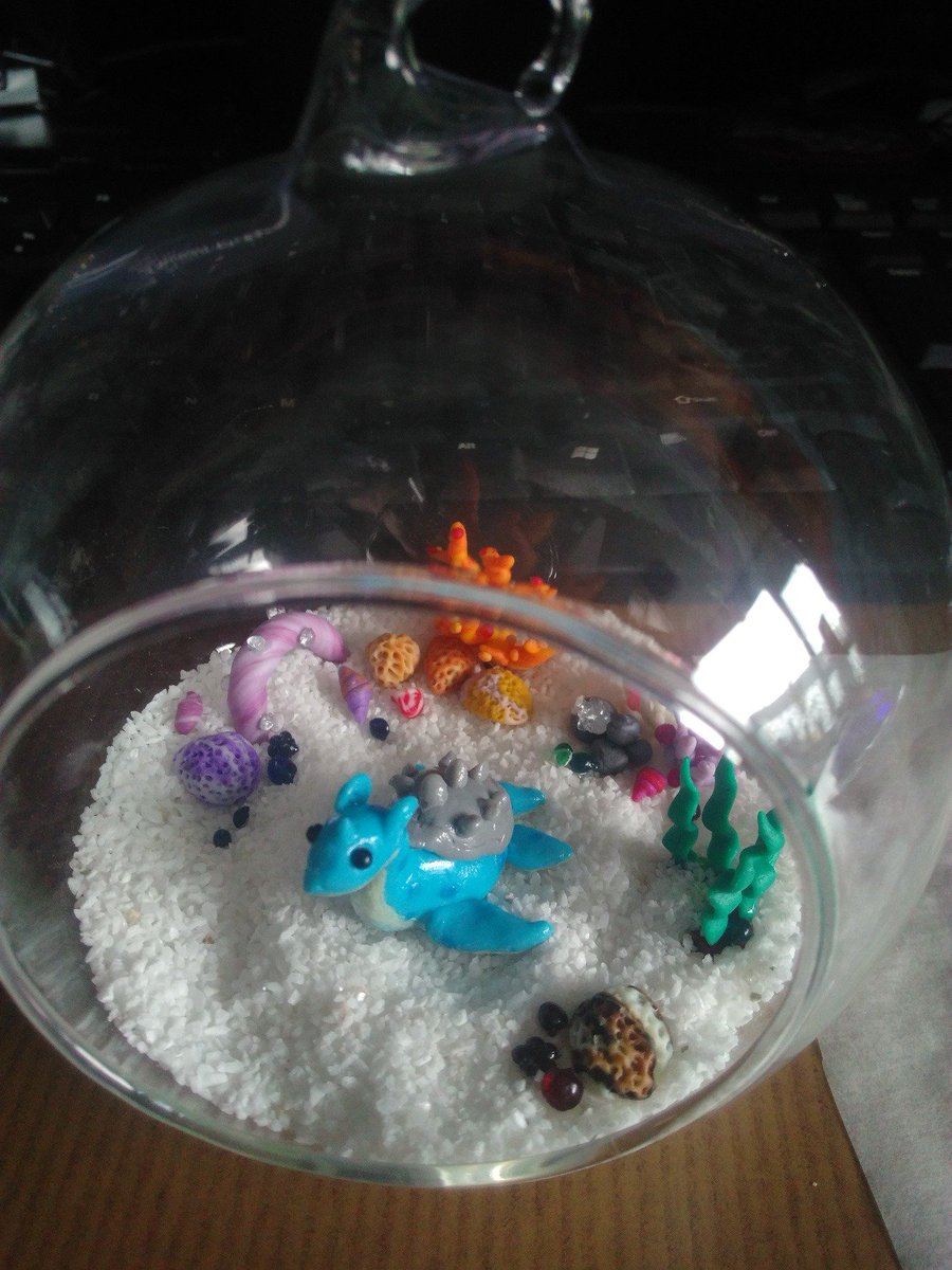 SilencedDesires's tweet photo. Got inspired by youtube channel @NerdECrafter 
Don't have any resin, too expensive.., so made it like this. Still works!
#lapras #pokemon #polymerclay #biome https://t.co/Honoibci0j