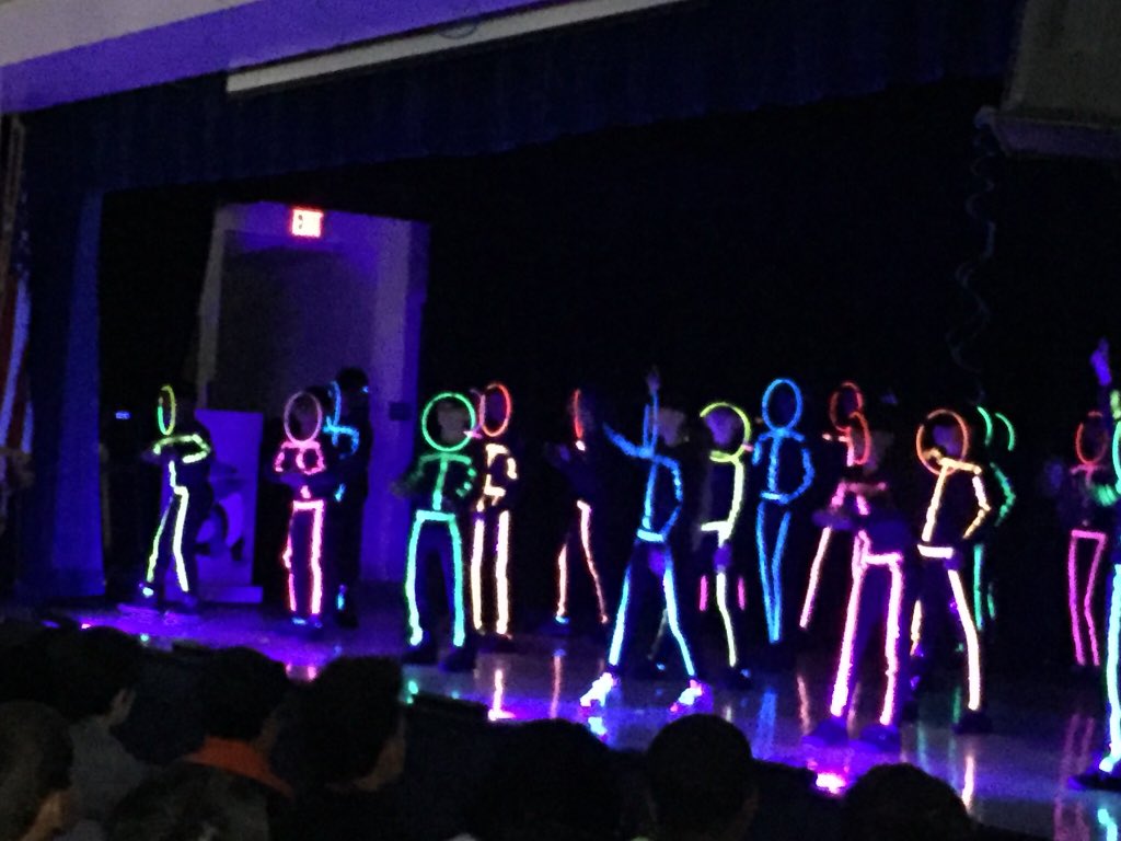 MrsSmall_'s tweet photo. Glow-in-the-dark dancing stick figures?!? Actually, it’s just the Sunrise Dance Team doing their thing at our Awards Assembly! Well done! #SunriseRocks @MCPS_Sunrise @kan070204 @DemonbreunMrs https://t.co/2LSf4dePOZ
