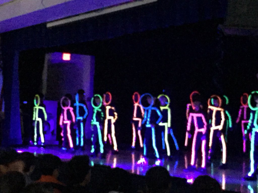 MrsSmall_'s tweet photo. Glow-in-the-dark dancing stick figures?!? Actually, it’s just the Sunrise Dance Team doing their thing at our Awards Assembly! Well done! #SunriseRocks @MCPS_Sunrise @kan070204 @DemonbreunMrs https://t.co/2LSf4dePOZ