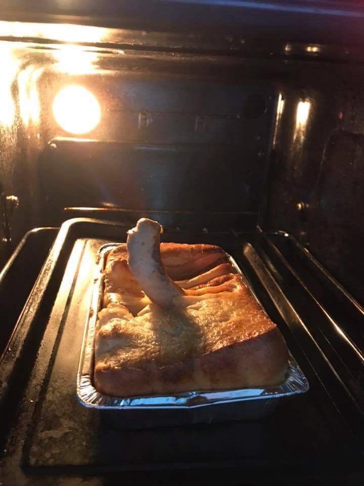 My sister in laws auntie is making toad in the hole and a sausage popped up 😂😂😂😂