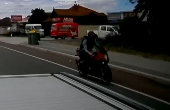 MidlandPol's tweet photo. #MidlandResponse would like your help identifying the rider of this red motorcycle, who evaded police shortly after 2.30pm Friday 23/3/18 on Great Eastern Hwy, Belmont. Did your significant other/brother/son/father or friend come home dress in a blue chequered shirt? #fb https://t.co/UM784LysWa