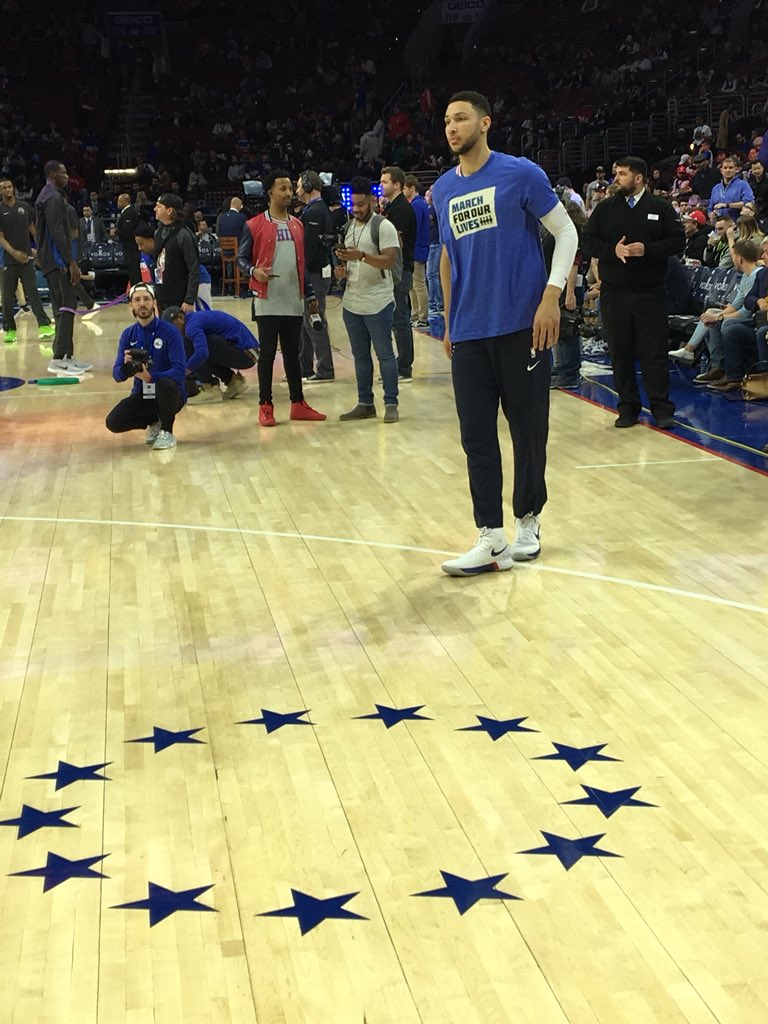Ben Simmons warming up in a #MarchForOurLives shirt.