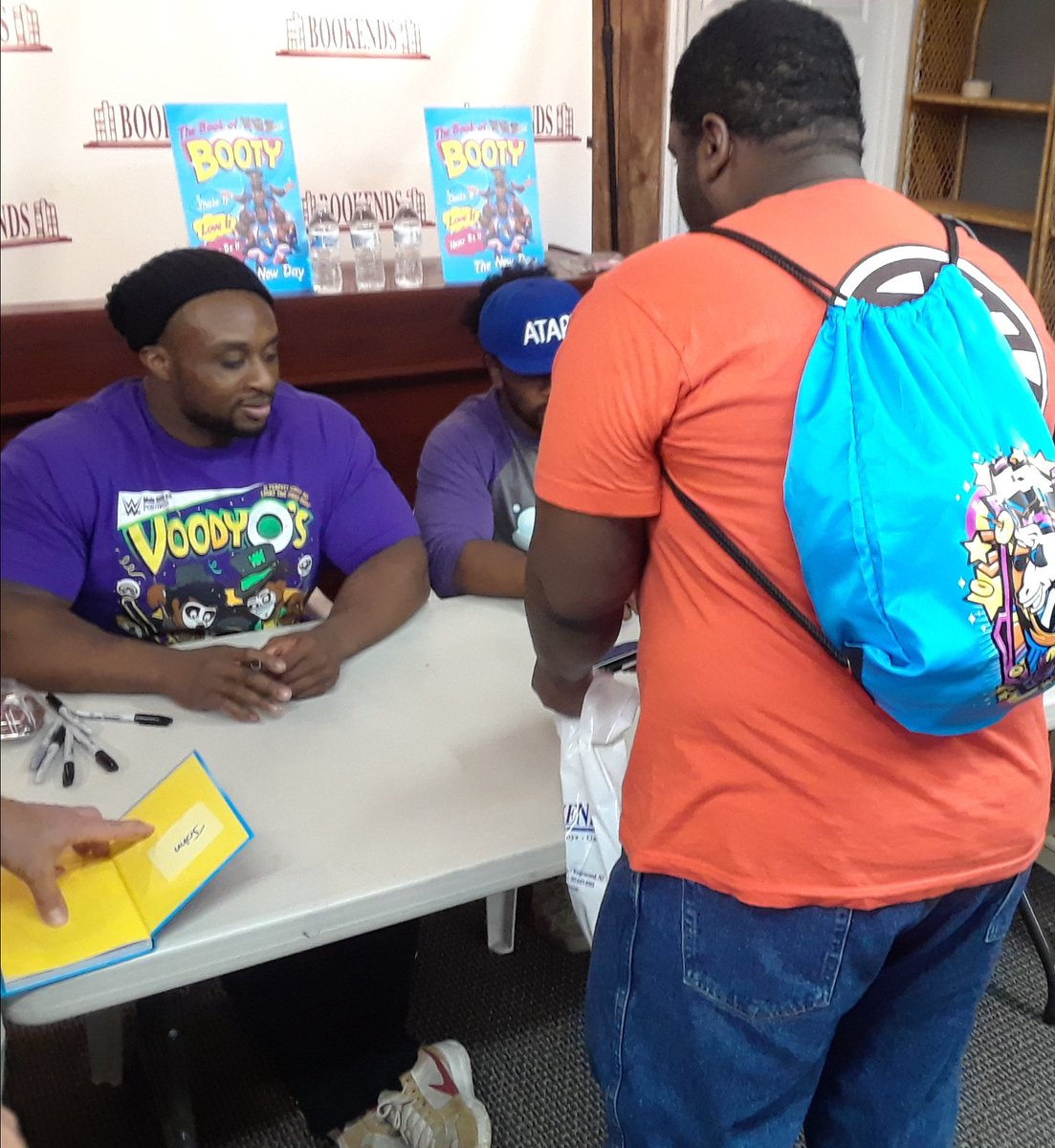 AmbitiousLeader's tweet photo. It was an honor to meet The New Day @WWEBigE @TrueKofi & @XavierWoodsPhD at @BookendsNJ. Meeting my favorite wrestling tag team of all time was an honor as these three are the best! Even got @UpUpDwnDwn signature from everyone on my 3DS. New Day Rocks! #newday #bookofbooty https://t.co/ol7yo2vhc3