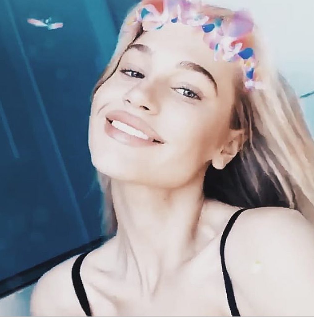 “ a princess with a flower crown and a very happy smile “