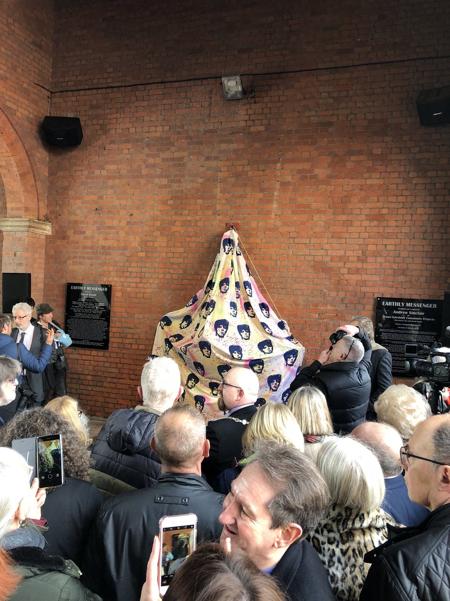 MichaelGarvey66's tweet photo. In Aylesbowie for the unveiling of the @DavidBowieReal Earthly Messenger statue. Not long to go. @ChandlerGarvey is proud to be a principal sponsor. https://t.co/jkWBB1TkN8
