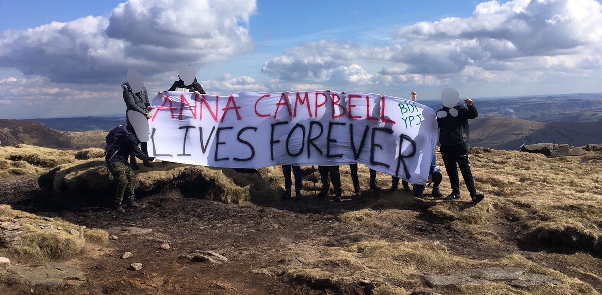 KurdsCampaign's tweet photo. Ramblers from Manchester way on top of Kinder Scout in the Peak District unravel a banner in memory of Anna Campbell, YPJ volunteer who was killed in Afrin by Turkish airstrikes #Ceasefire4Afrin #BringAnnaHome #DefendAfrin https://t.co/BbOYmGVots