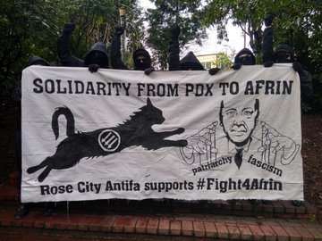 Solidarity From PDX to Afrin Banner with Antifa cat attacking Erdogan. Rose City Antifa supports #Fight4Afrin