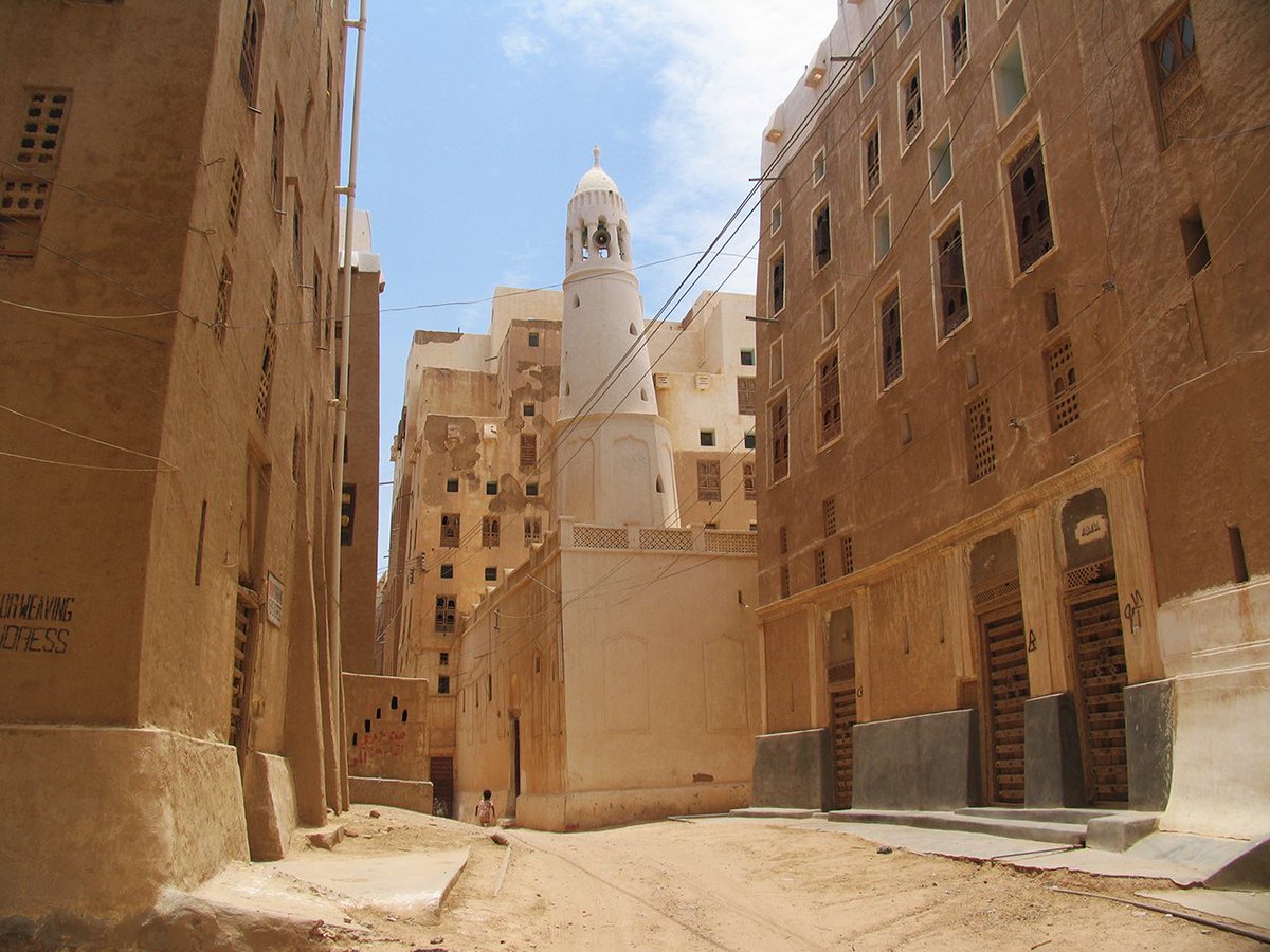 A typical Shibam high rise (the first high rise city in the world, with some buildings dating back to the 16th c.) is up to 30m tall, with 7-8 stories, each story being between 2-6m tall. The ground floor walls are often 1.3-2m thick.