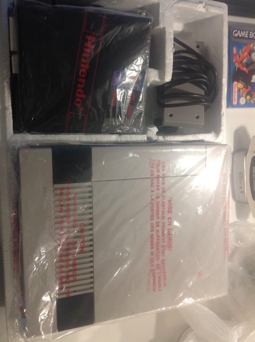 TheRetroShed28's tweet photo. What a find! Boxed and wrapped NES with manuals and original poster. @thegamechasers #RETROGAMING #NES #Nintendo https://t.co/wxwQdsmacR