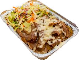 "Kapsalon" is a Dutch dish combining the most unhealthy ingredients that various culinary cultures have to offer. A layer of French fries is topped with a layer of shawarma, topped with lettuce, heavily doused with garlic sauce and hot sauce, covered with molten cheese.