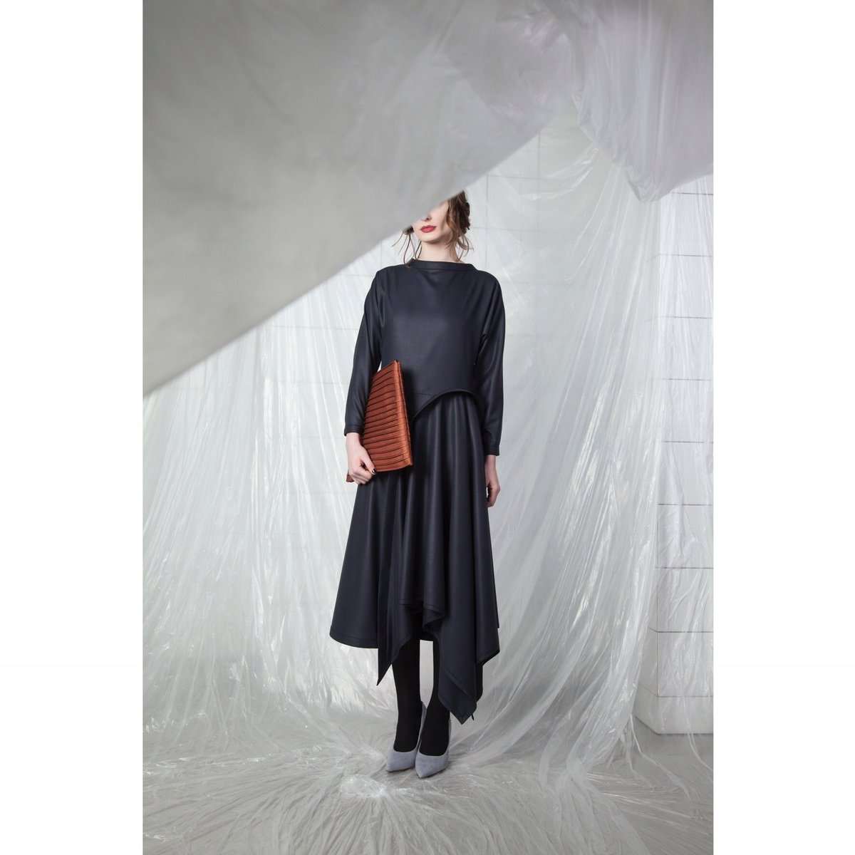 Sai Coat - double layered covered in pintucks. Limited edition -30% 

Nina Dress - assymetrical front cut and the copper colored pin that pintuck clutch, covered fully in pintucks - 30%