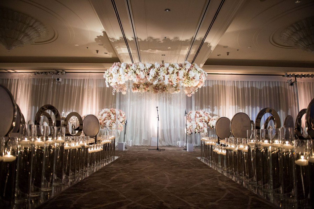 Floating candles illuminated the space and lined the aisle to the glorious chuppah, which showcased a canopy of blooms in shades of blush and ivory. bit.ly/2CmtDY6 <a href="/BobGailEvents/">Allyson Levine</a> <a href="/whitelilacinc/">White Lilac Inc.</a> <a href="/RevelryDesign/">Revelry Event Design</a> 
(John Solano Photography) #chuppah