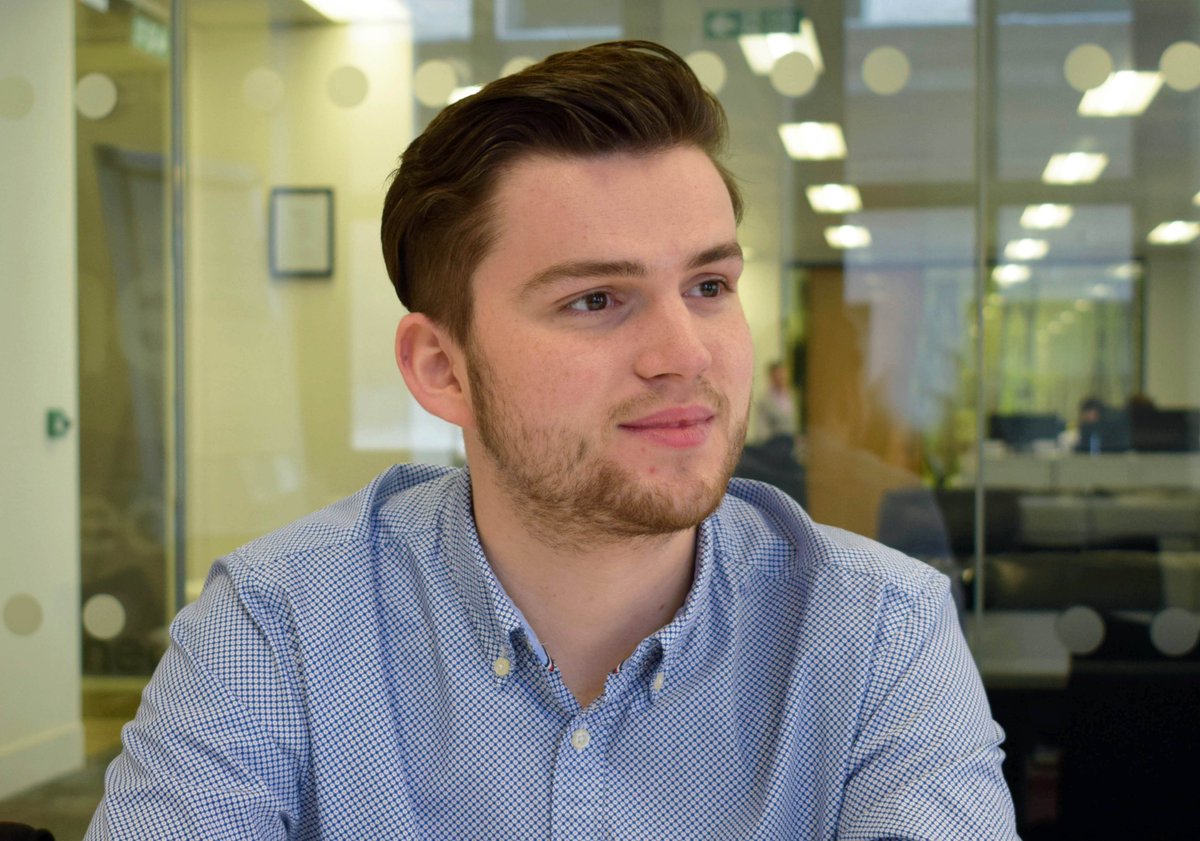 photo of Ian Fairley, a young white man in an office