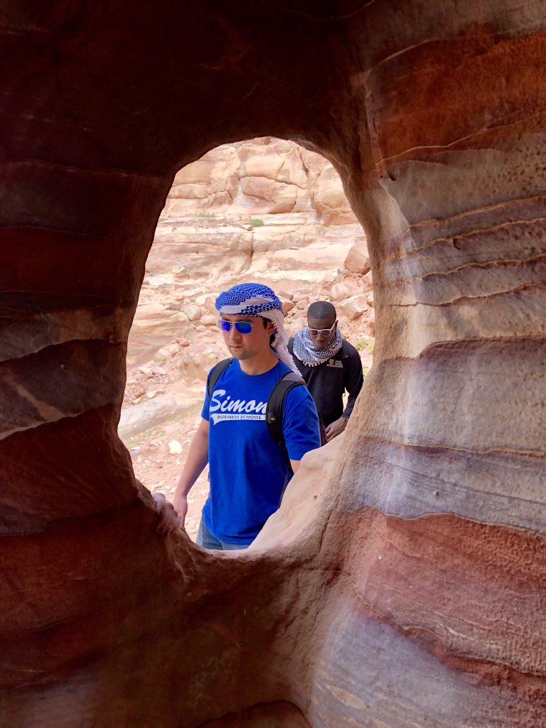 tanur_madaree's tweet photo. Spent today exploring the magical ruins of Petra, here’s Steve Chew captured through a cave window #Simonmba #SimontakesJordan @SimonSchool https://t.co/m1wsUX1fDz