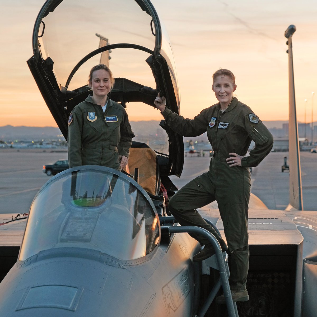 Production has begun on Marvel Studios' #CaptainMarvel. @BrieLarson receives instructions from Brigadier General Jeannie Leavitt, 57th Wing Commander, on a recent visit to Nellis Air Force Base in Nevada to research her character.