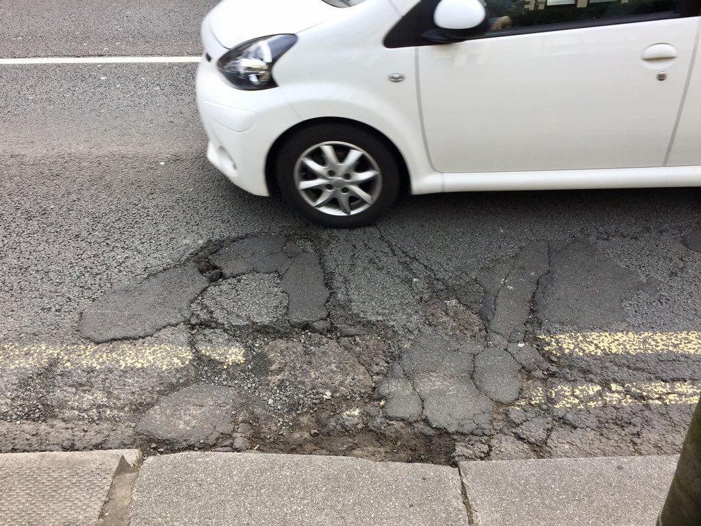 mathtalfan's tweet photo. Very dangerous road conditions on Newport Road. Regularly forced into #potholes by passing traffic when #cycling. Whole stretch littered with holes. Can it be addressed @cardiffcouncil ? https://t.co/W0JOAlC6Om