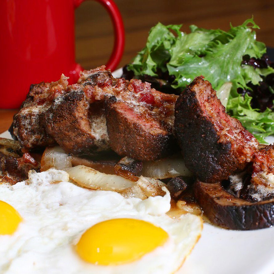 Steak and Eggs have never looked or tasted so good. Coffee-rubbed bistro tender, sautéed mushrooms and onions, and chili maple bacon butter...need we say more?