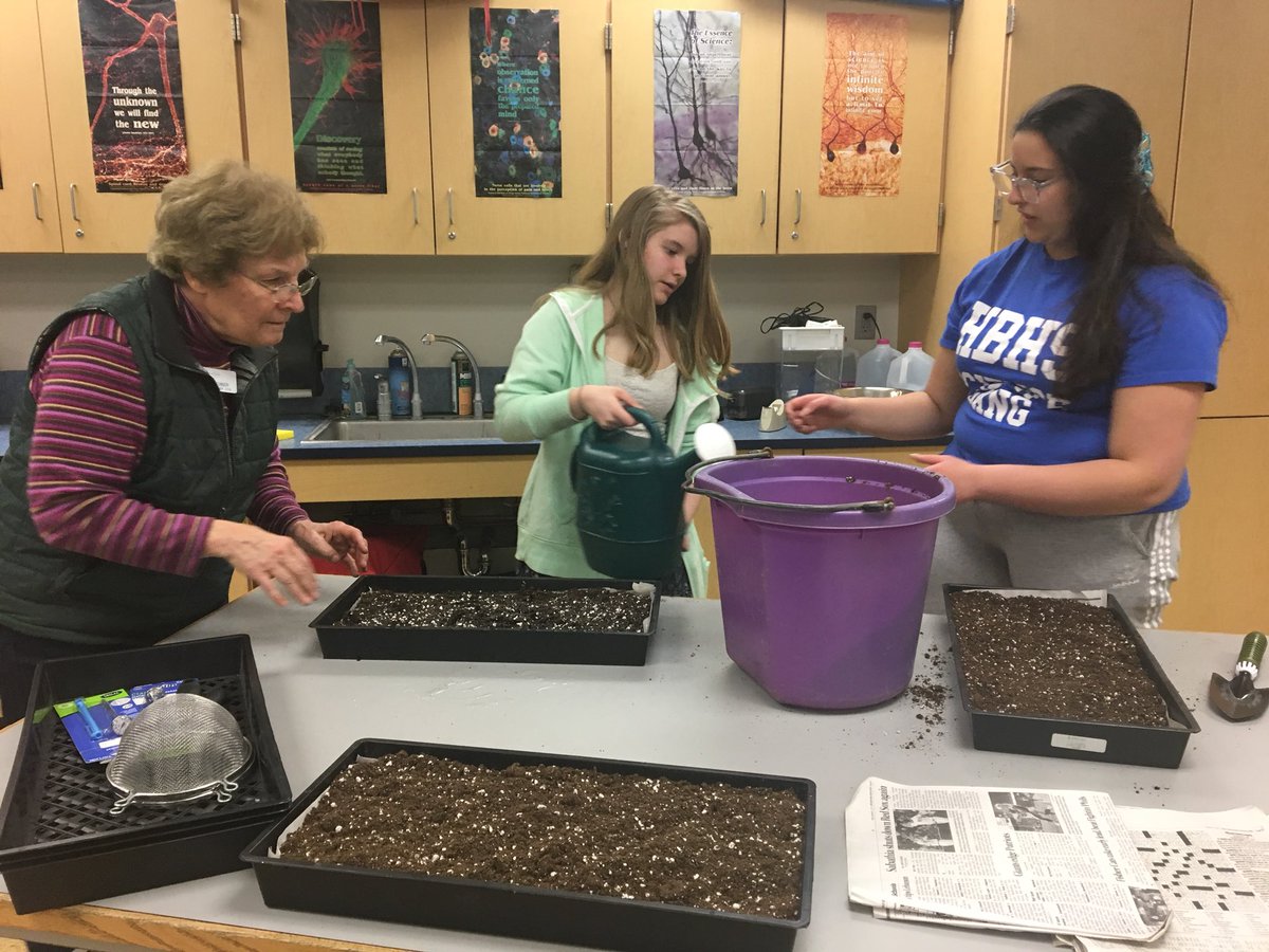 HBMSGreenhouse's tweet photo. Thank you to Lorrie O’Conner and Tom Woodward for joining us during Green Group today. They are from the UNH master gardener program and a HUGE help! Planting has officially begun! #hbgg @UNHExtension @UNHExtensionHC https://t.co/HLRGX1YAbj