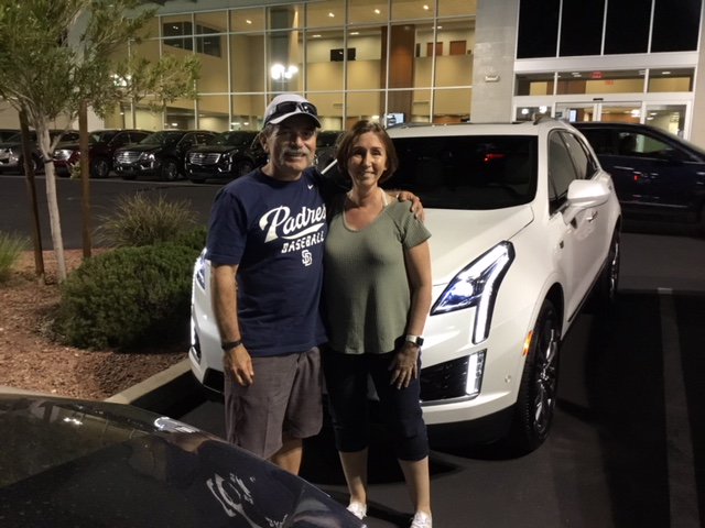 FindlayCadillac's tweet photo. Danny and Catherine in front of their new 2018 XT5, moving here to Henderson. WELCOME to the valley! #Cadillac #FindlayCadillac #CadillacXT5 #BrandNew #LuxuryVehicle #ValleyAutoMall #Henderson #LasVegas #ThatNewCarSmell https://t.co/oeNlbI7uY0